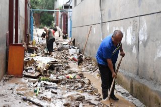 Les pluies diluviennes qui ont frappé Pékin et la province voisine du Hebei (nord) ont fait jusqu'à présent au moins 20 morts et 19 disparus, selon les médias officiels. Ici, le village de Shangwan.